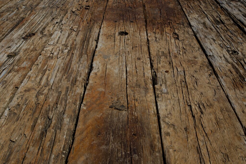 wooden floorboards with rot